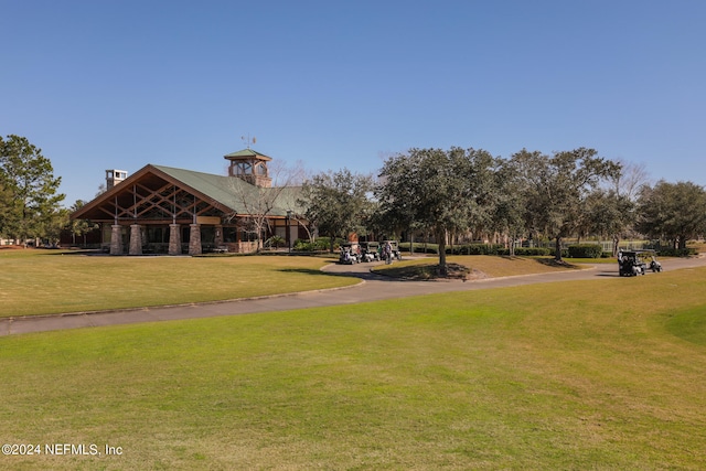 view of property's community featuring a playground and a yard