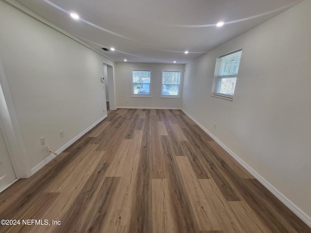 spare room featuring wood-type flooring