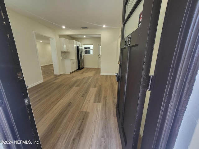 hall featuring light hardwood / wood-style flooring