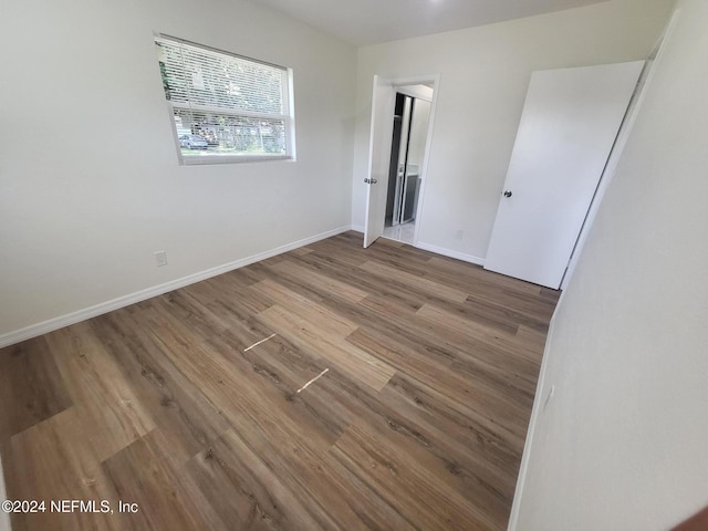 spare room with hardwood / wood-style floors