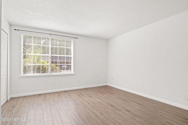 unfurnished room featuring light hardwood / wood-style flooring