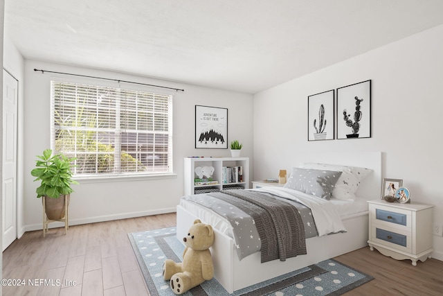 bedroom featuring wood-type flooring