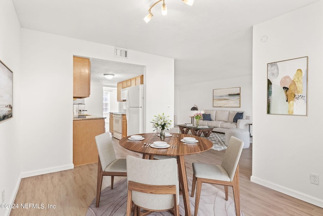 dining room featuring light hardwood / wood-style floors