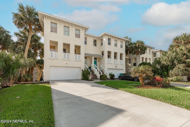 view of front facade featuring a front yard and a garage