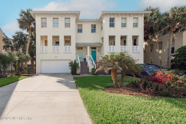 view of front facade with a front yard and a garage