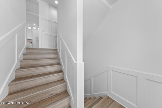 stairway featuring hardwood / wood-style floors