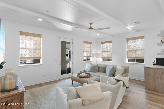 living room featuring beamed ceiling, ceiling fan, cooling unit, and light hardwood / wood-style floors