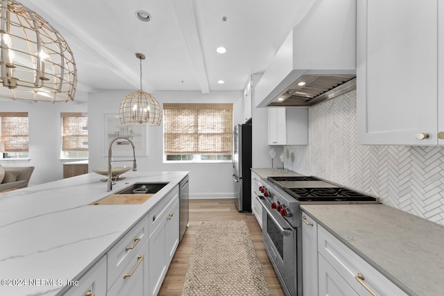 kitchen with white cabinets, custom exhaust hood, appliances with stainless steel finishes, and beam ceiling