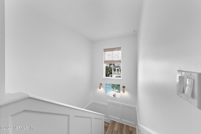 staircase featuring hardwood / wood-style floors