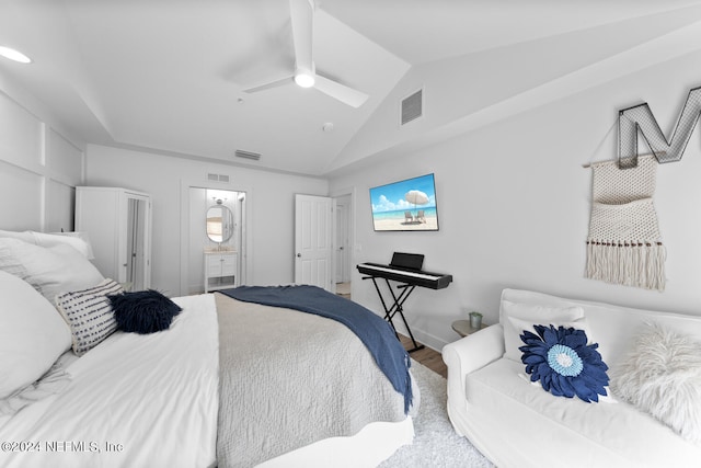 bedroom with lofted ceiling, wood-type flooring, ensuite bath, and ceiling fan