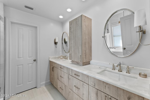 bathroom featuring tile patterned floors and vanity