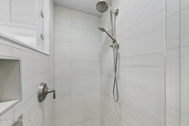 room details with a tile shower