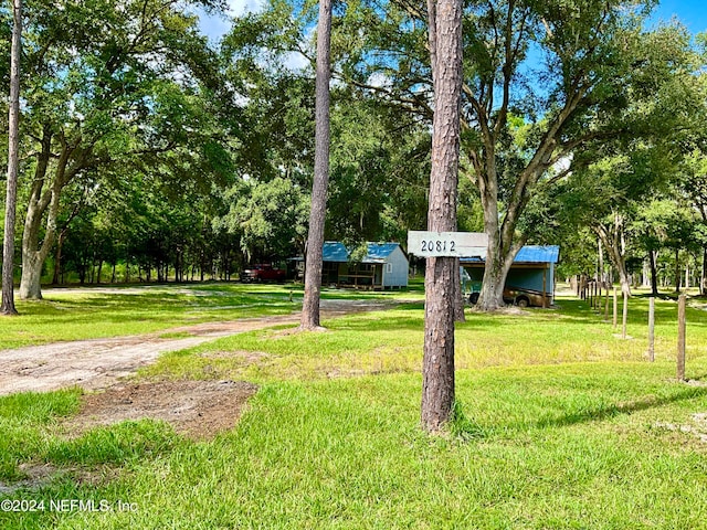 view of home's community featuring a lawn