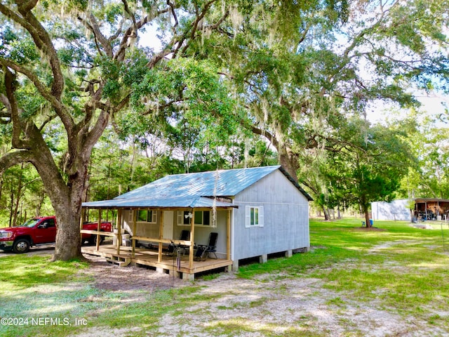 exterior space featuring a yard and a deck