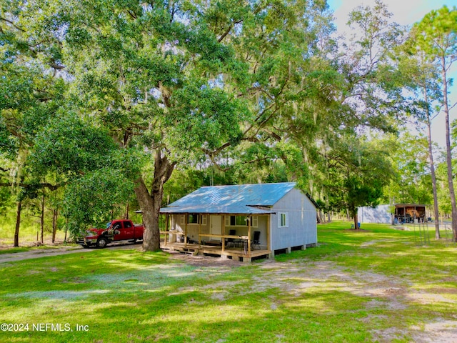 exterior space with a yard and a deck