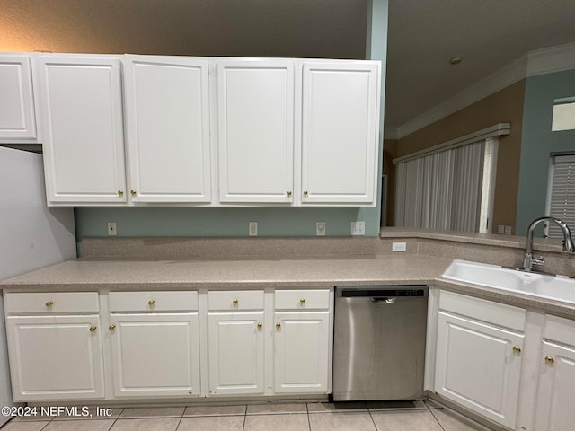 kitchen featuring light tile patterned floors, ornamental molding, sink, stainless steel dishwasher, and white cabinetry