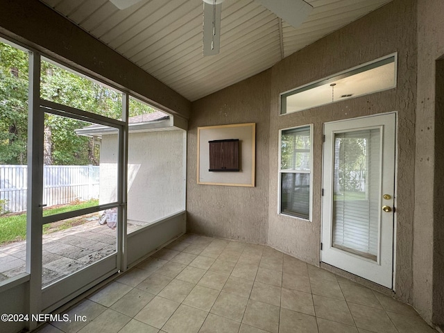 unfurnished sunroom with vaulted ceiling