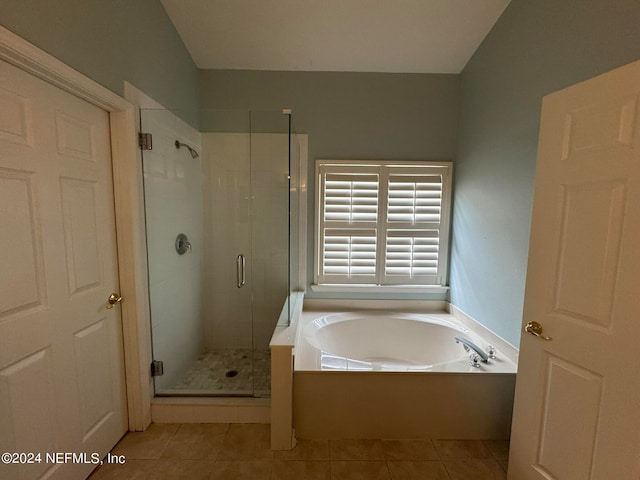 bathroom featuring tile patterned floors and shower with separate bathtub