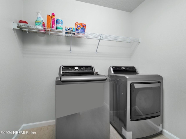 laundry area featuring washing machine and clothes dryer