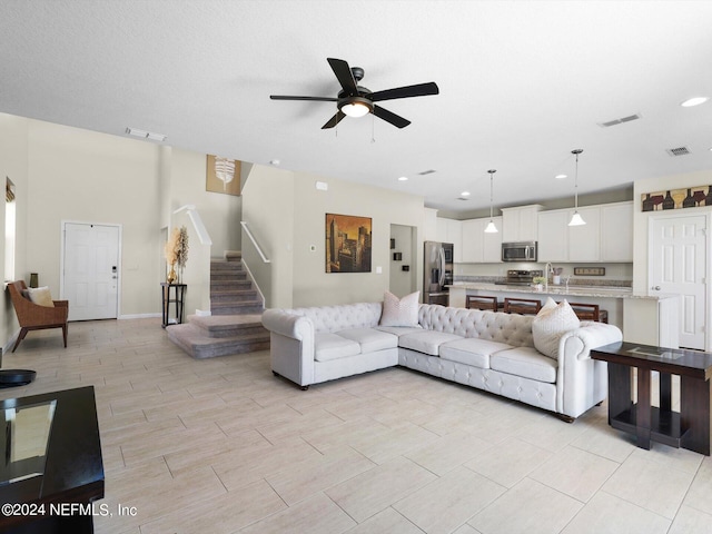 living room featuring ceiling fan