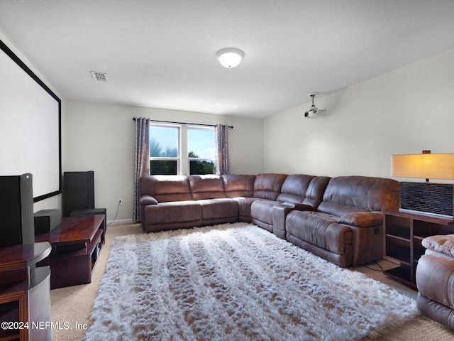 living room featuring light carpet and a textured ceiling