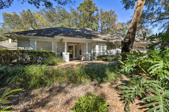 single story home featuring a garage