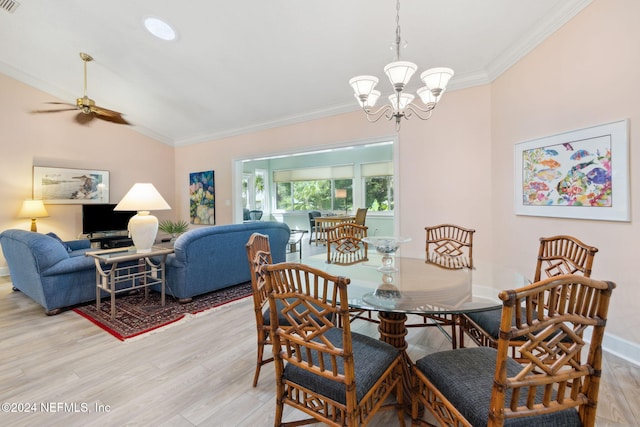 dining space with crown molding, light hardwood / wood-style flooring, and ceiling fan with notable chandelier