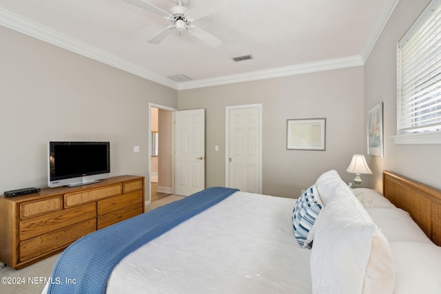 bedroom featuring ceiling fan and crown molding