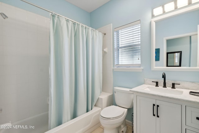 full bathroom with vanity, shower / tub combo, and toilet