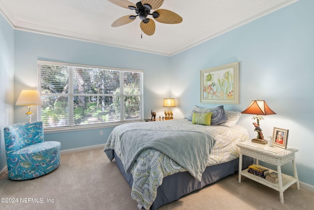 bedroom with crown molding, carpet floors, and ceiling fan