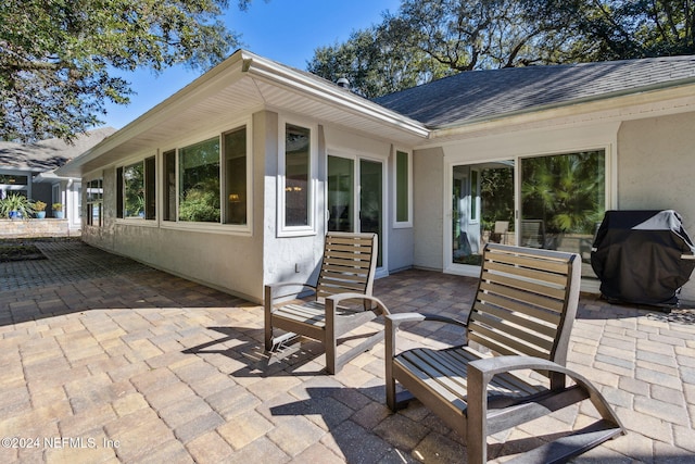 view of patio featuring a grill