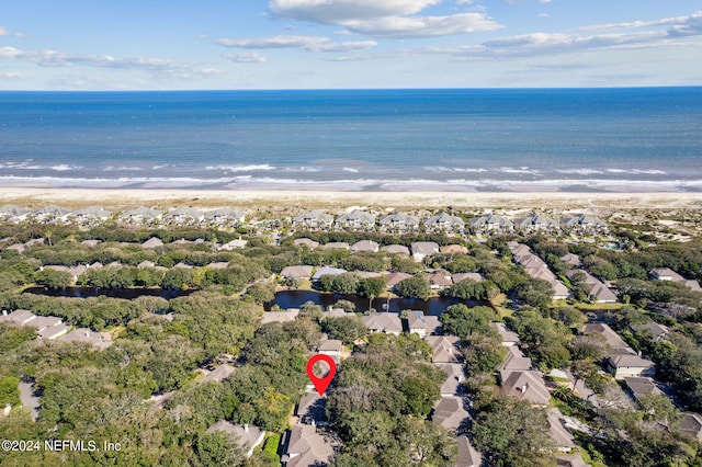 bird's eye view with a water view and a view of the beach