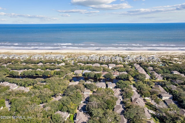 bird's eye view featuring a water view and a view of the beach