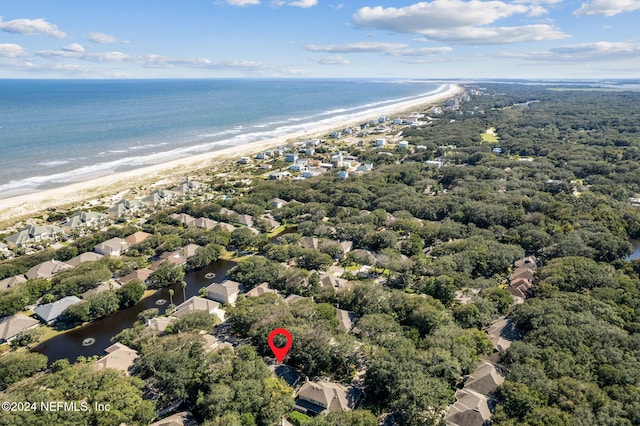 aerial view featuring a water view and a beach view