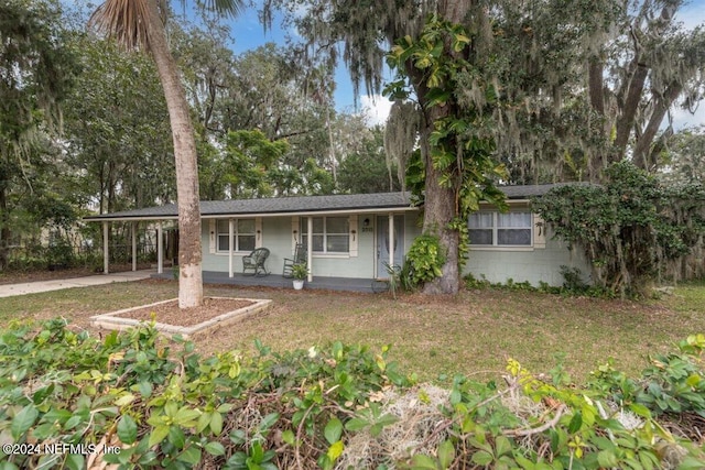 ranch-style house with covered porch