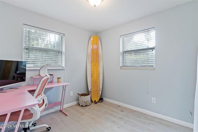 home office featuring light hardwood / wood-style floors and a wealth of natural light