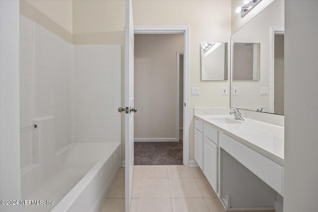 bathroom featuring vanity, bathtub / shower combination, and tile patterned flooring