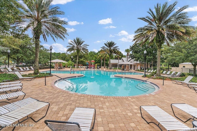 view of swimming pool with a patio area