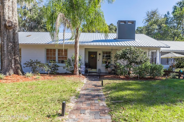 ranch-style house with a front yard