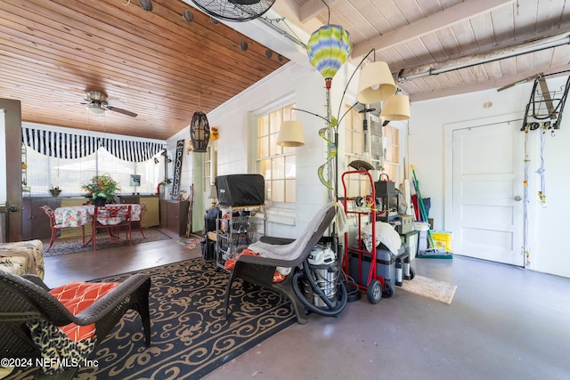 garage featuring ceiling fan and wooden ceiling