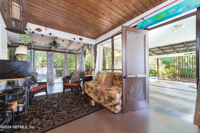 sunroom / solarium featuring ceiling fan and wooden ceiling