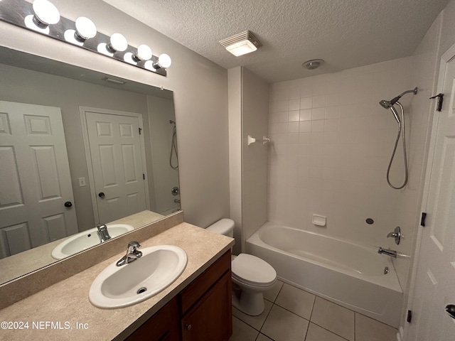 full bath with tile patterned floors, toilet, shower / washtub combination, a textured ceiling, and vanity