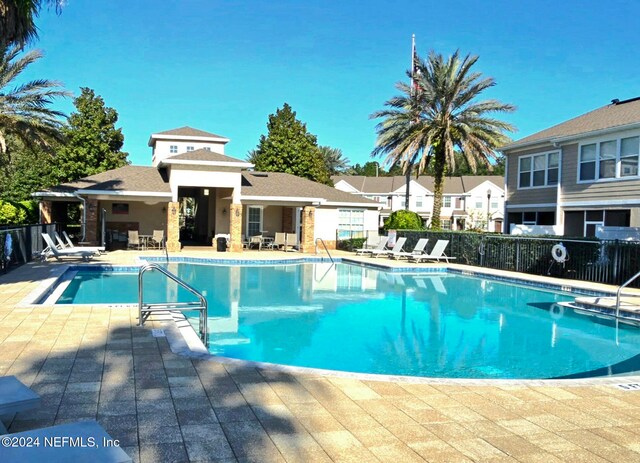 view of swimming pool with a patio