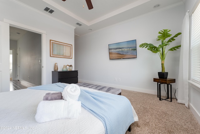 bedroom featuring ceiling fan, carpet floors, and crown molding