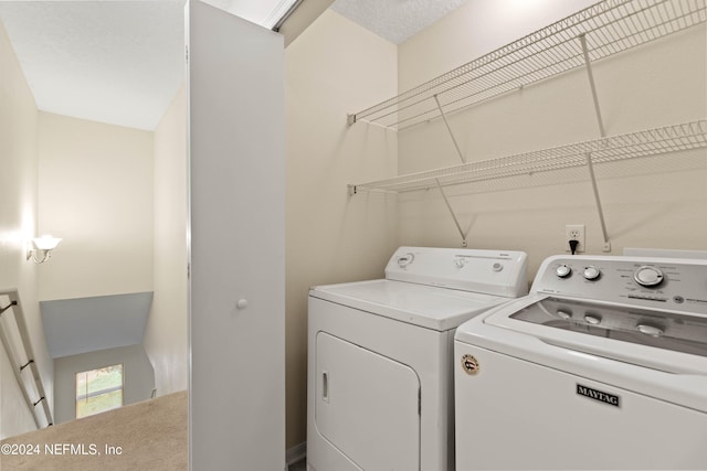 laundry room with washing machine and clothes dryer