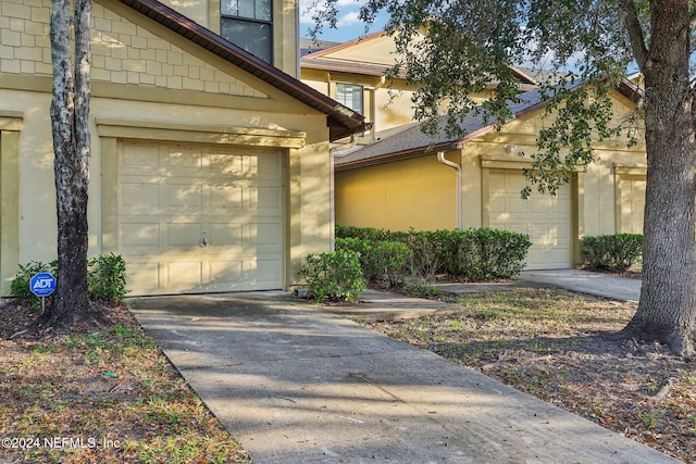 view of exterior entry with a garage