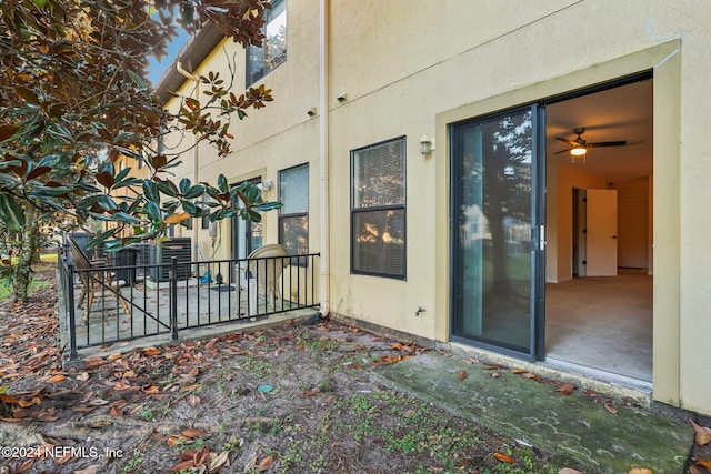 entrance to property with central air condition unit and a patio area