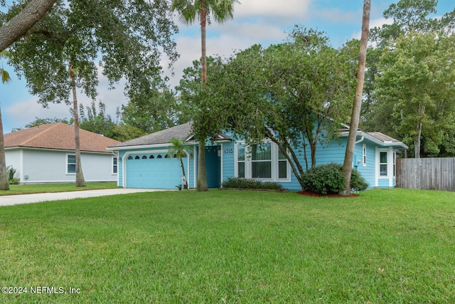 ranch-style house with a front lawn and a garage