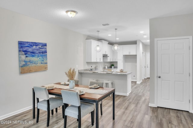 dining area featuring light hardwood / wood-style floors