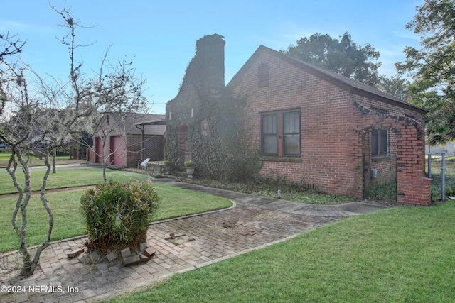 view of home's exterior with a yard